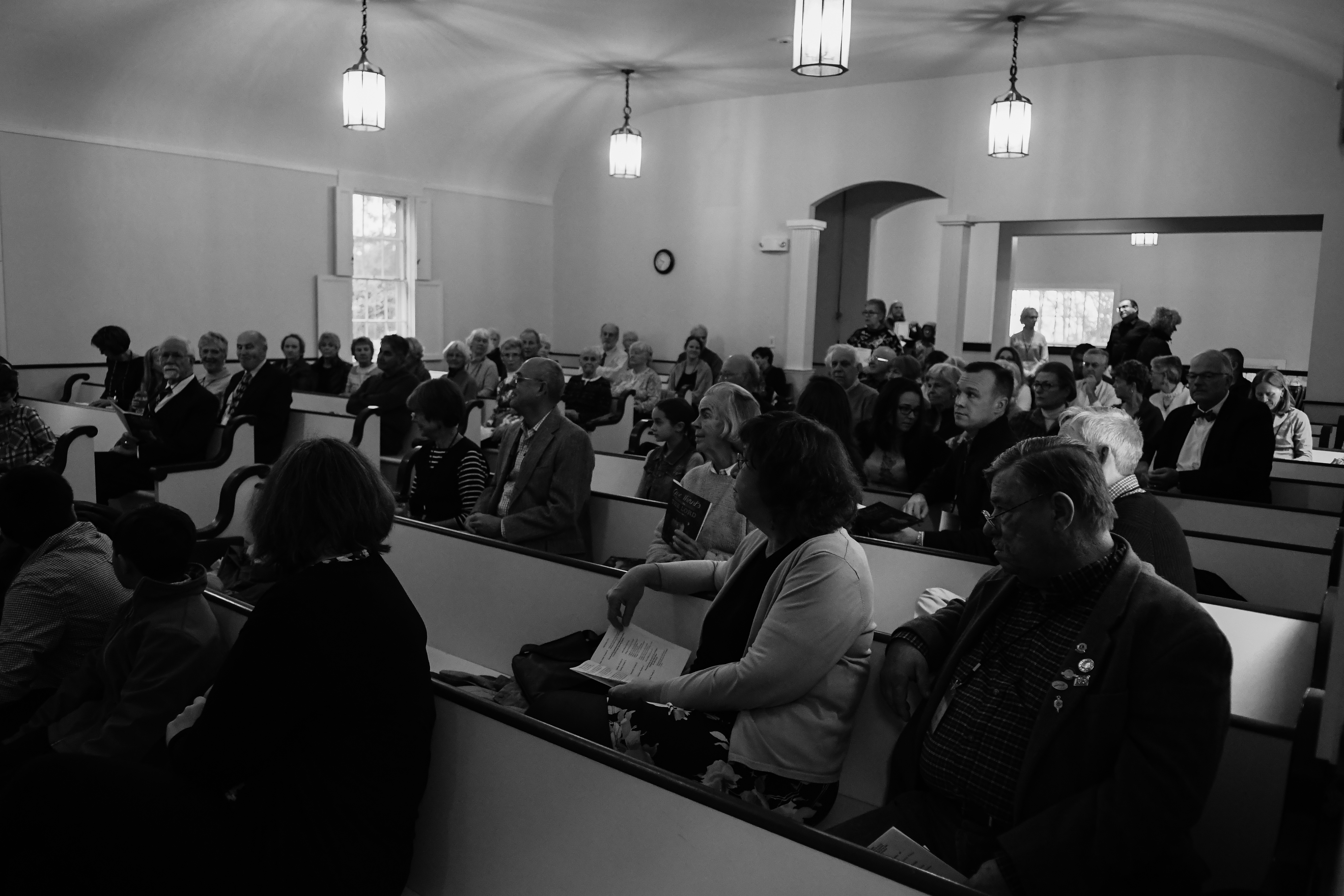 Folks sitting during announcements